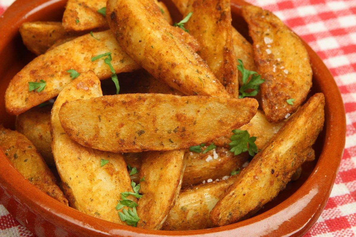 Herbed Greek fried potatoes with feta cheese