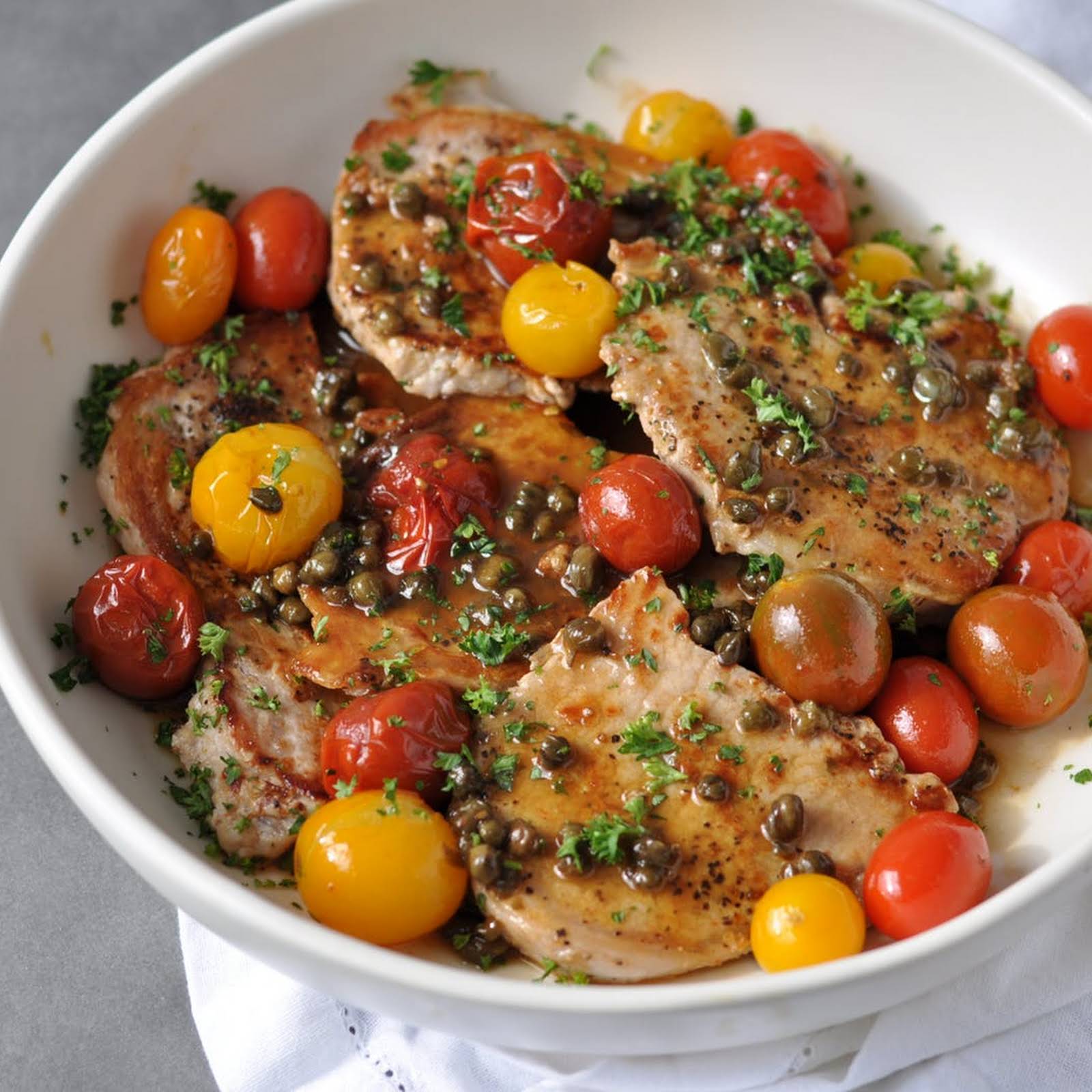 CHICKEN MEDALLIONS WITH CAPERS & TOMATOES